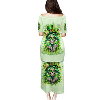 Green long dress with off-shoulder neckline; skull and shamrock graphic on back