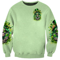 Green unisex sweatshirt with small front skull shamrock graphic and patterned sleeves