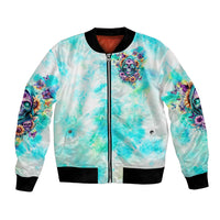 Unisex light blue bomber jacket with front zipper and skull floral artwork, black ribbed hem