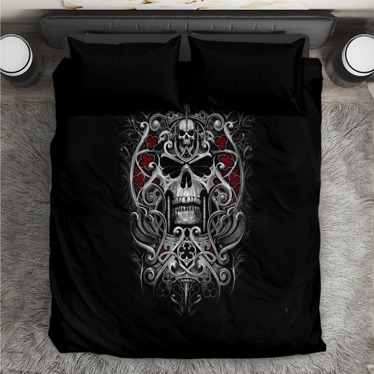 Black bedding set with ornate skull graphic on duvet and two matching pillows