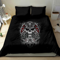 Black bedding set with ornate skull face artwork on duvet and two pillows
