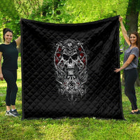 Black quilt with diamond stitching and centered skull artwork, red eye accents