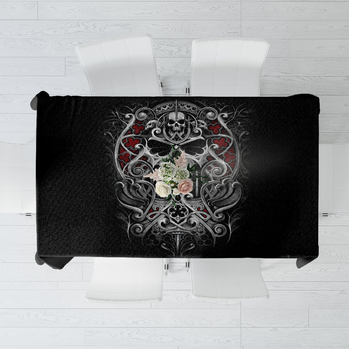 Black skull tablecloth with ornate death emblem and floral details.