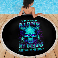 Black round beach blanket with fringe, neon skull graphic and '24/7' text