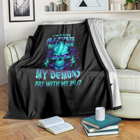 Black flame skull blanket on couch with neon skull graphic and 'I'm never alone' text