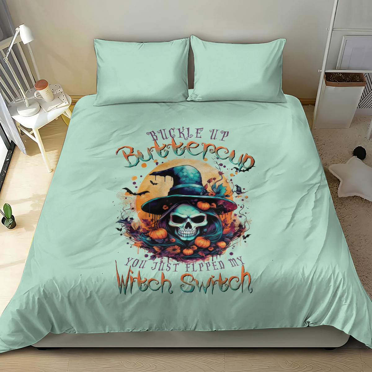 Mint blue bedding set with witch skull graphic centered on comforter and two pillowcases