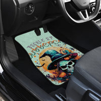 Witch skull graphic car floor mat in vehicle footwell, mint background and hat artwork