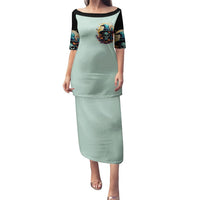 Mint green long dress with black short sleeves and colorful skull witch graphic, front view