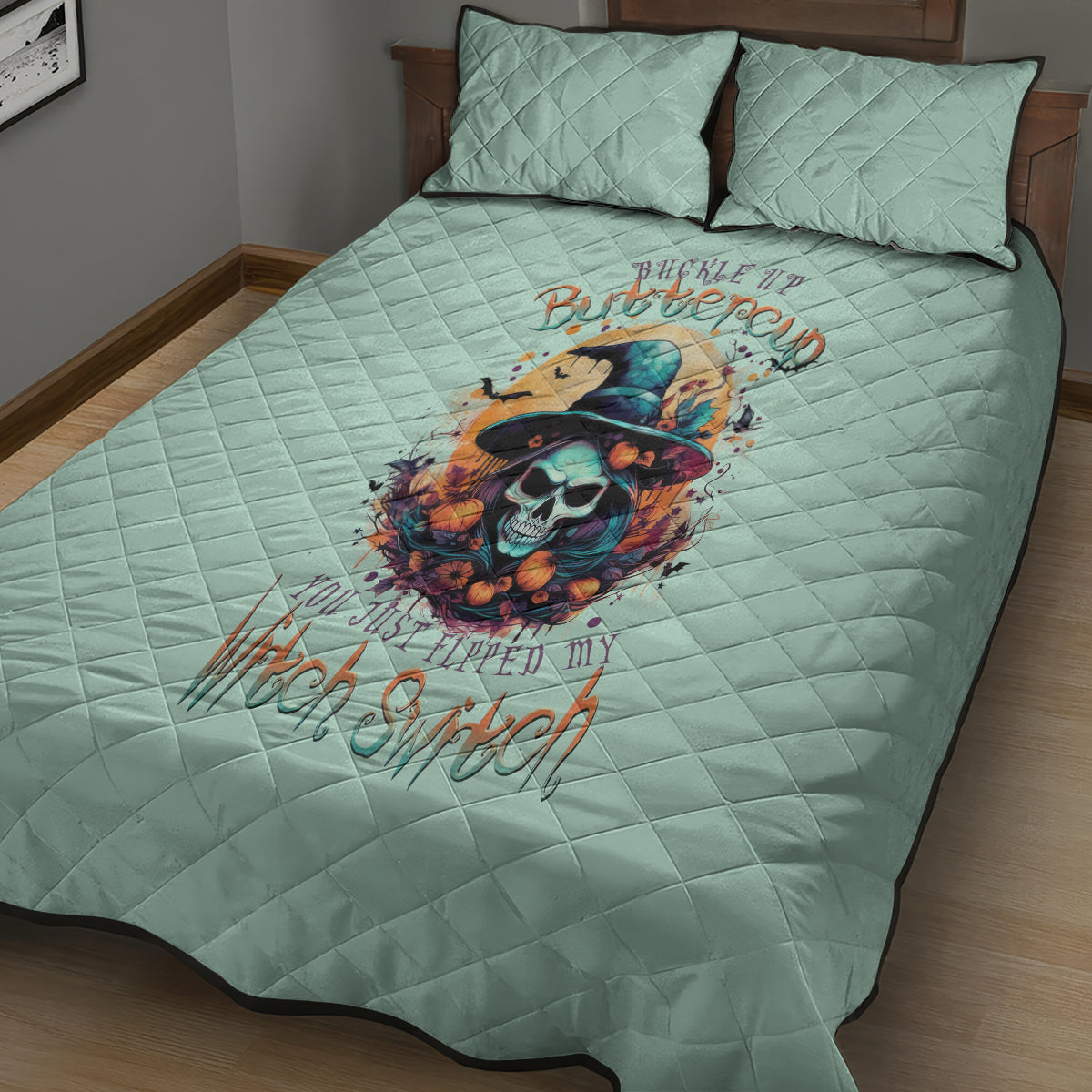 Seafoam blue quilt bed set with skull and witch graphic, includes two matching pillows