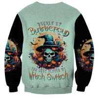 Unisex mint green sweatshirt with skull witch graphic and black long sleeves