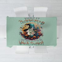 Mint green tablecloth close-up: witch skull design with “Witch Switch” text