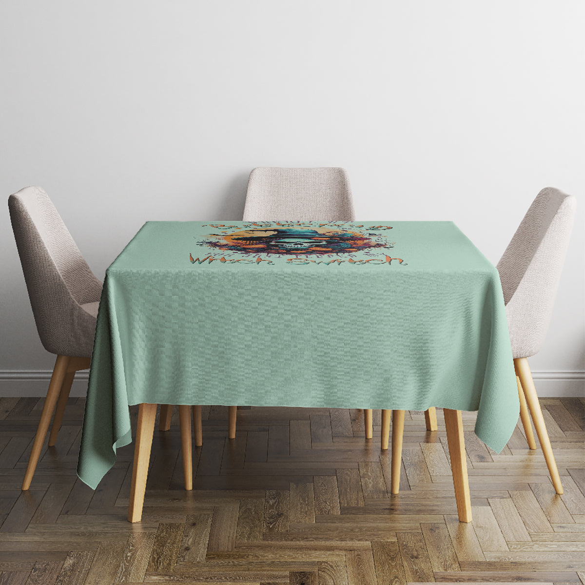 Mint green tablecloth with witch skull artwork, straight hem at table edges