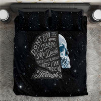 Black starry bedding set with central skull graphic on duvet and two matching pillows