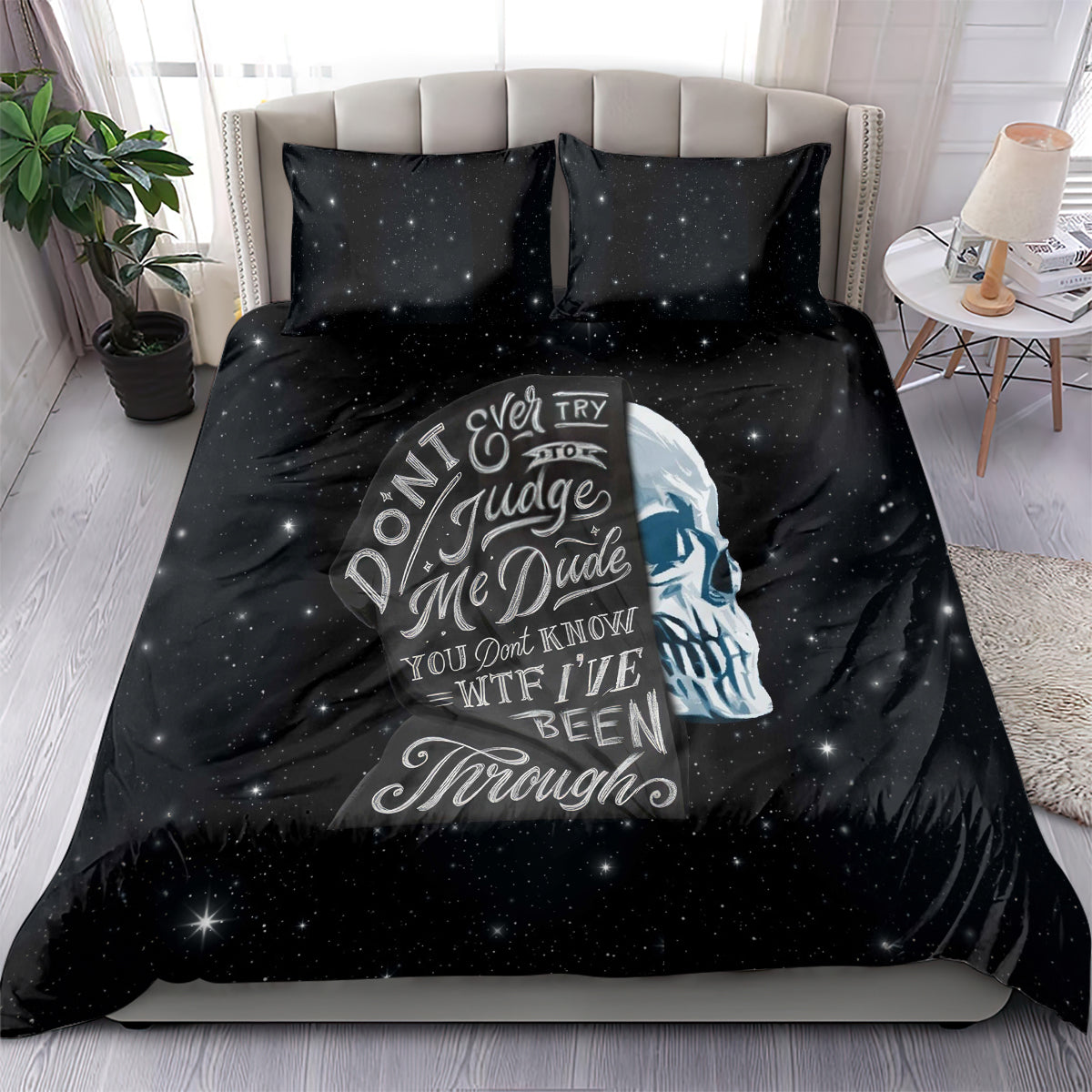 Black galaxy bedding set with graphic skull face and quote on duvet and pillows