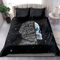 Black galaxy bedding set with graphic skull face and quote on duvet and pillows