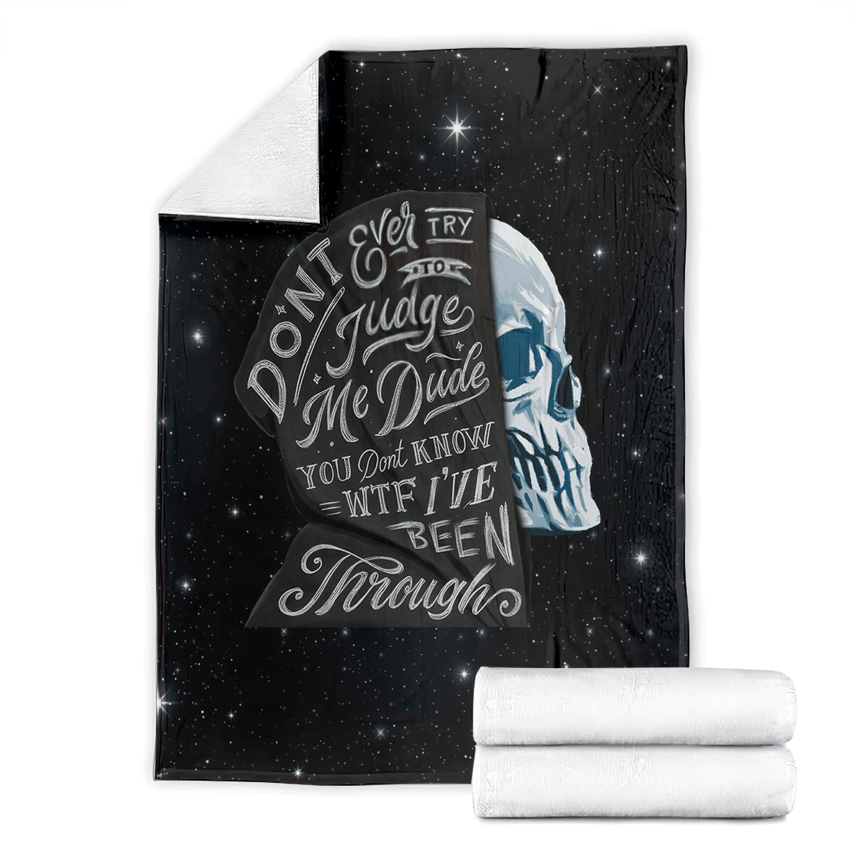 Black skull quote blanket with stars, featuring large face print and quote text