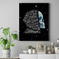 Framed canvas wall art with blue-and-white skull profile and circular quote design on stars