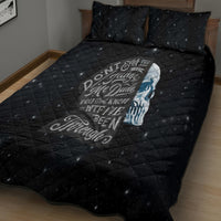 Black quilt bed set with quilted grid, blue skull graphic, and two matching pillows