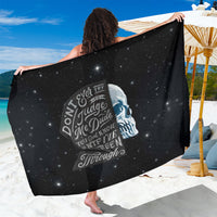 Black skull graphic sarong with starry print, back view wrapped