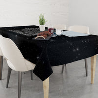Black skull tablecloth draped on a dining table with starry speckled design