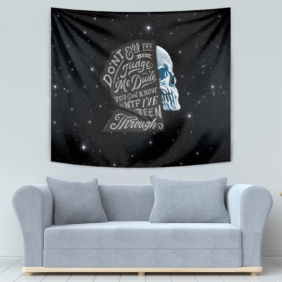 Black starry tapestry with a blue skull face silhouette and quote-style text