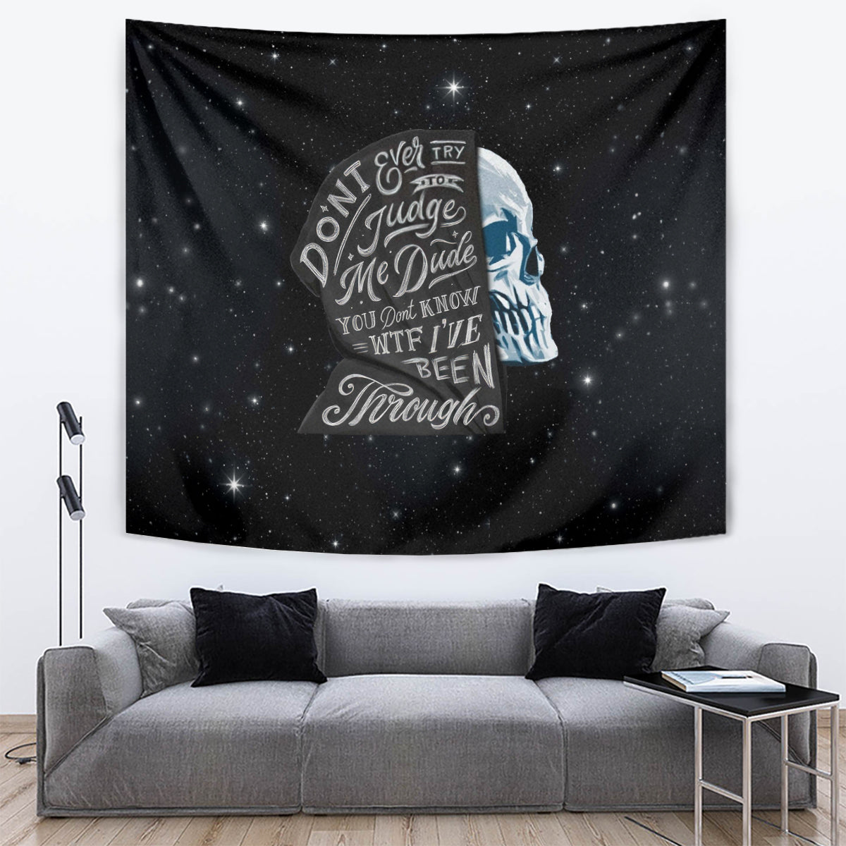 Black cosmic tapestry featuring a blue skull profile and italic quote text