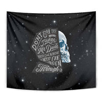 Black starry wall tapestry with blue skull profile and layered typographic quote