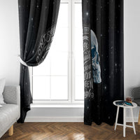 Black skull window curtain with patterned text and star speckle design near window