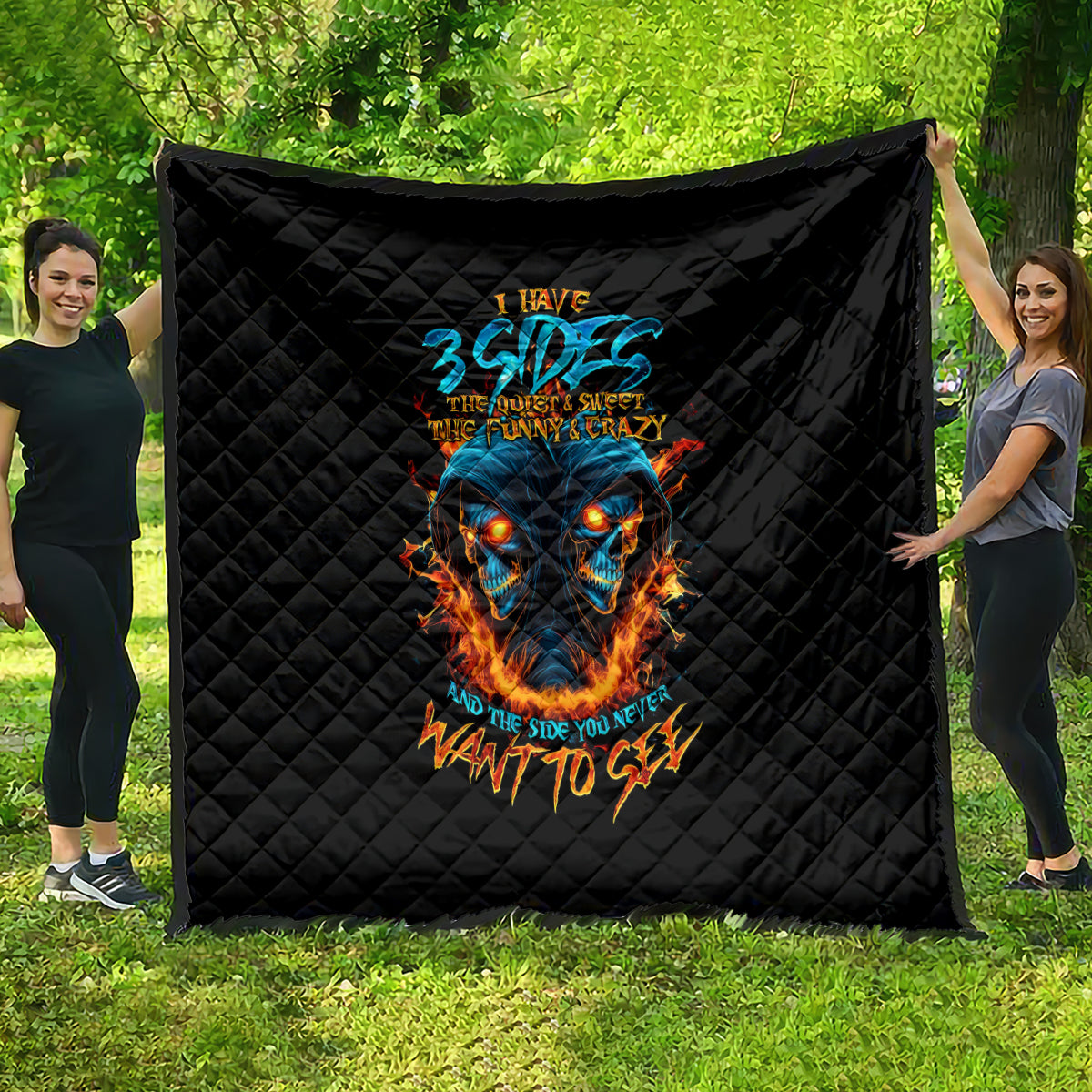 Black quilted blanket with blue skull and orange flame graphic, diamond stitch