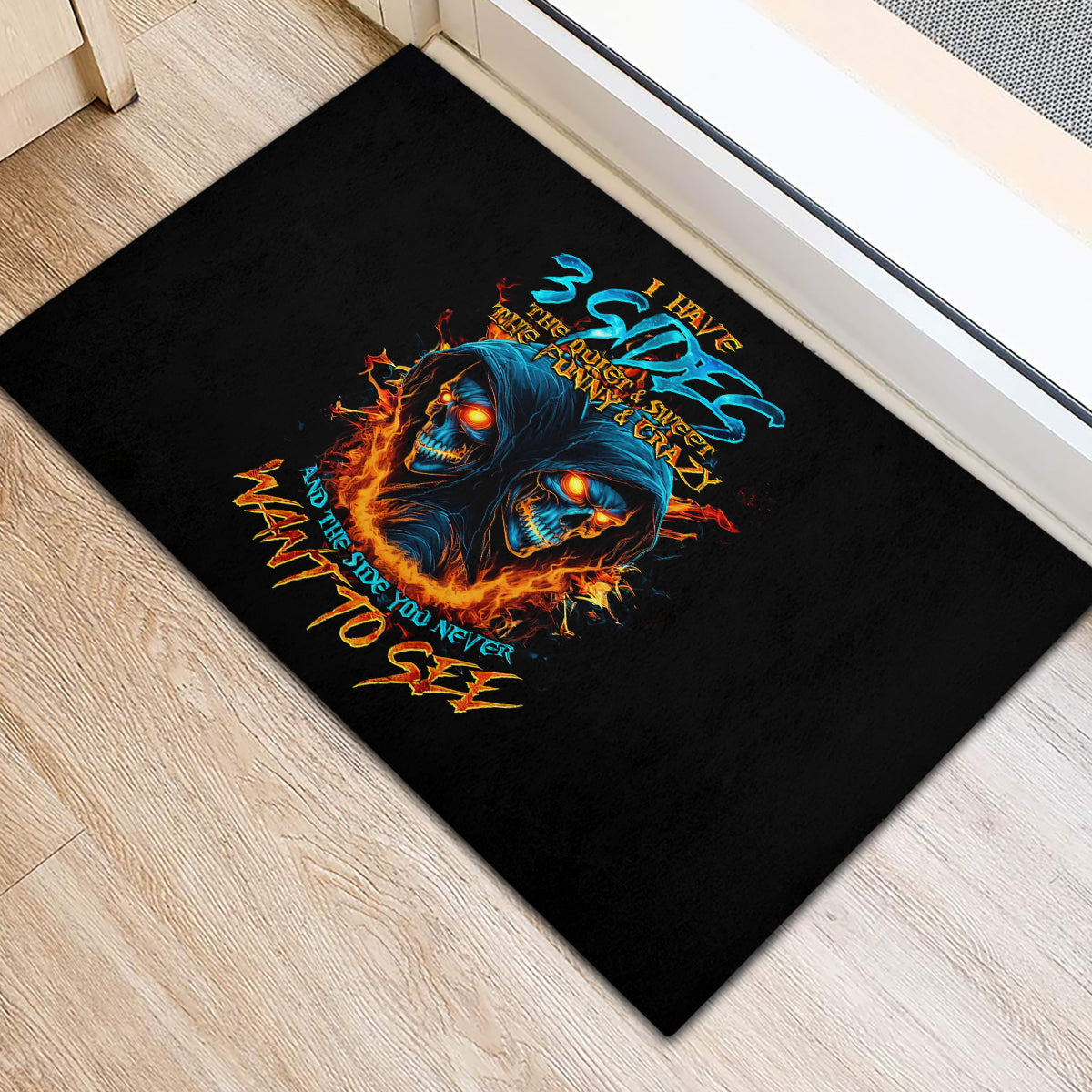 Rectangular black rubber doormat with blue and orange double skull graphic