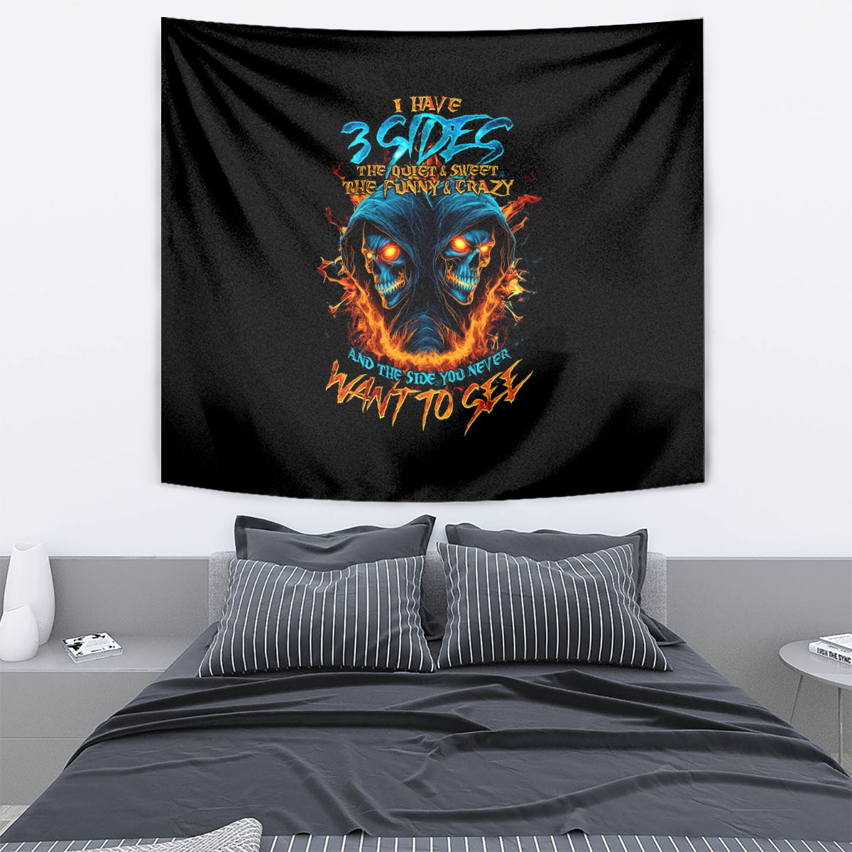 Black skull tapestry with blue-orange flames graphic, draped wall hanging