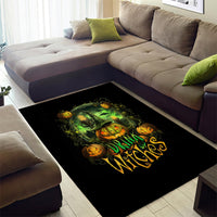 Black Halloween area rug with green cauldron, orange pumpkins, and 'Drink Witches' design