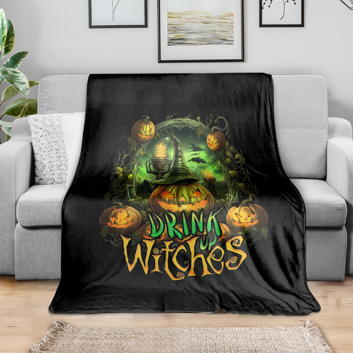 Black halloween drink up witches throw blanket with glowing green cauldron and pumpkins