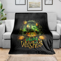 Black halloween drink up witches throw blanket with glowing green cauldron and pumpkins