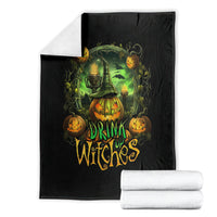 Black halloween throw blanket with green cauldron, pumpkins, and drink up witches artwork