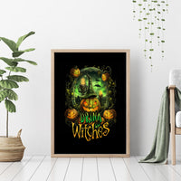 Wood-framed Halloween canvas wall art with green witch, pumpkins, and “Drink Witches” text