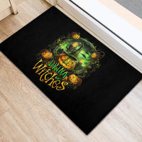 Black rectangular rubber doormat with green witch pumpkin graphic and 'Drink Witches' text