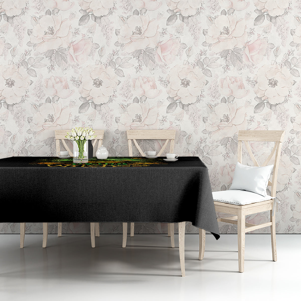 Black tablecloth with green pumpkin skull border and partial 'Drink up Witches' text.
