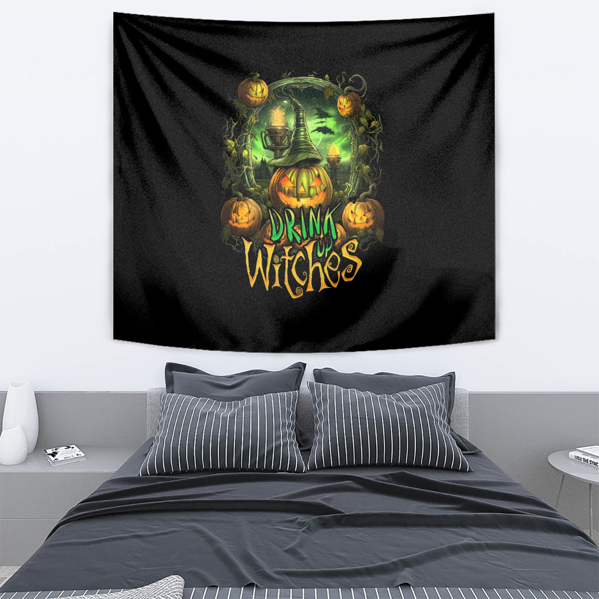 Black Halloween tapestry with green witch, pumpkins, and text 'DRINK UP WITCHES'