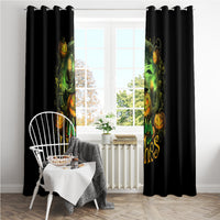 Black window curtain panels with glowing green witch and pumpkin faces near a bright window