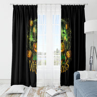 Black window curtain panels with green glowing witch and pumpkin faces, framed by white sheers