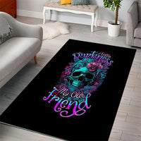Black rectangular area rug with teal skull and purple floral graphic, neon script