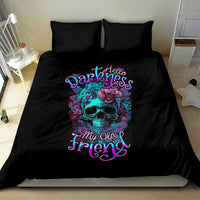 Black bedding set with central skull-flower print and purple lettering; duvet