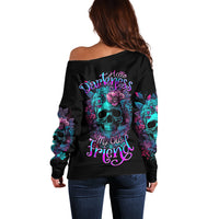 Black off-shoulder sweater with skull and floral graphic on back