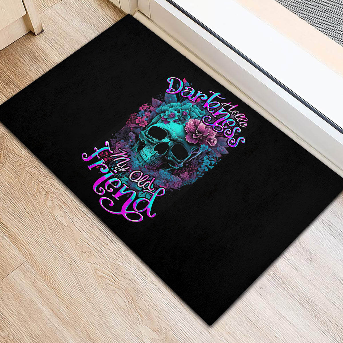 Black rubber doormat with blue-pink skull and floral neon lettering