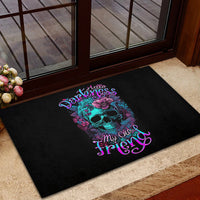 Black rubber doormat featuring teal skull with purple flowers and neon lettering