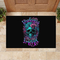 Black rubber doormat with centered teal skull, purple flowers, and pink neon text