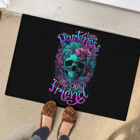 Black rubber doormat with teal skull floral graphic and neon lettering, textured