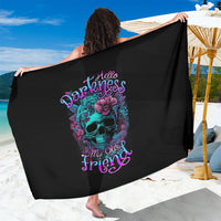 Black sarong wrap with purple skull and flowers design, held open to show full print.