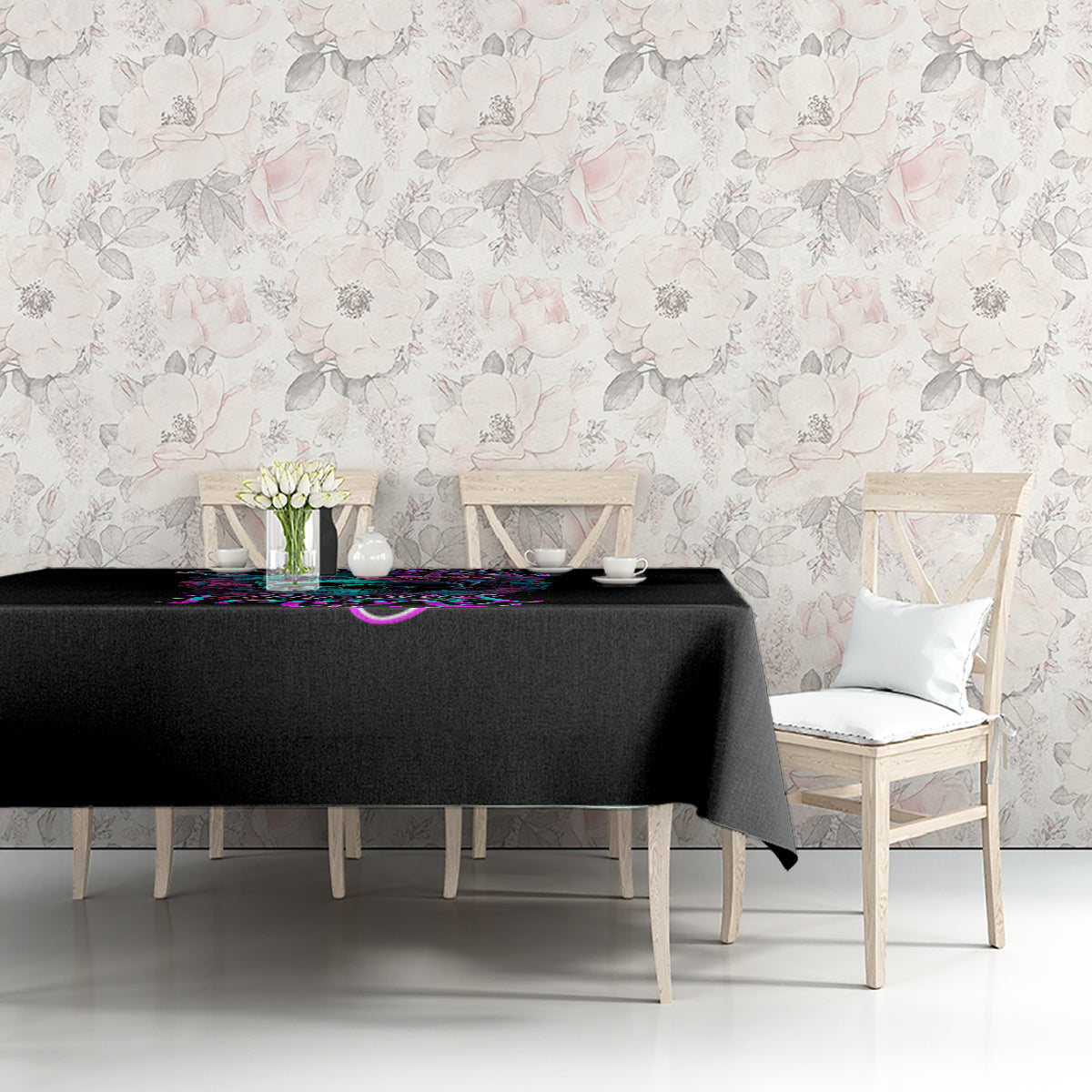 Black tablecloth with colorful neon skull and floral graphic on tabletop